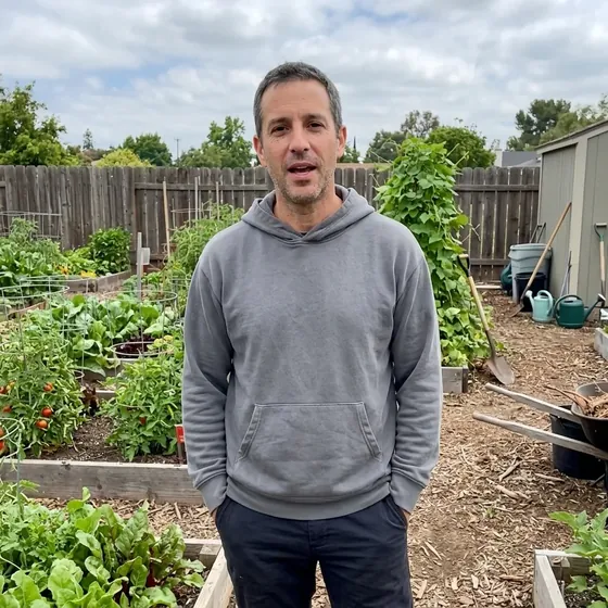 Man smiling in a garden